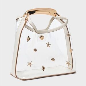 Clear and gold bag NWT seashell beach design. Comes with small wallet